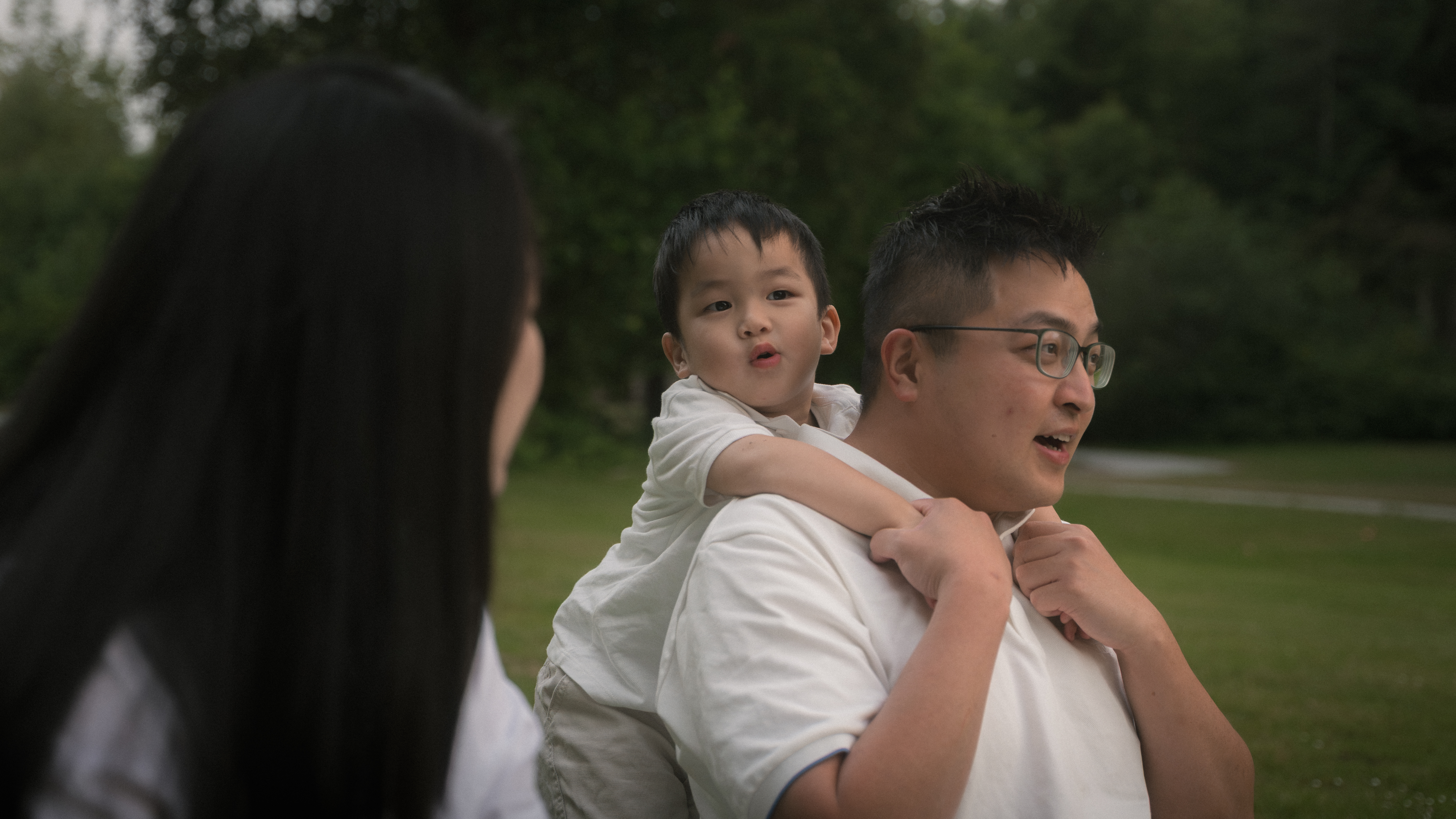 A family laughing together in a close embrace
